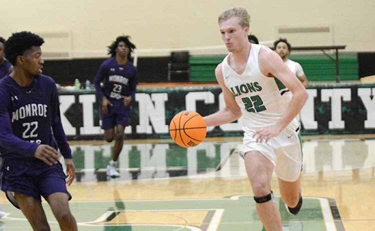 Dane Burton drives toward the basket in a win over Monroe Area Tuesday in Carnesville. (Photo by Scoggins)