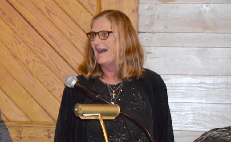 Diane Holmes reacts in shock as she reaches the podium after being announced as Citizen of the Year at the Lavonia Chamber of Commerce Banquet Thursday at the Depot downtown. (Photo by Sinclair)