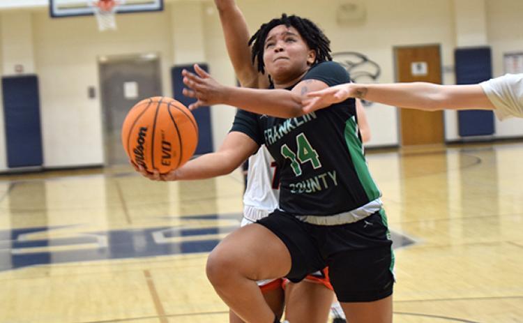 Ny'Kerriah Brown goes up for a layup in the region consolation game victory over Hart County. (Photo by Scoggins)