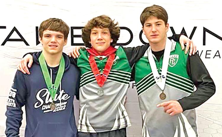 (From left) Jacob Baughcum, Kenly Eavenson and Wilder Davis each finished in the top four of their respective weight classes at the GHSA State Championships.