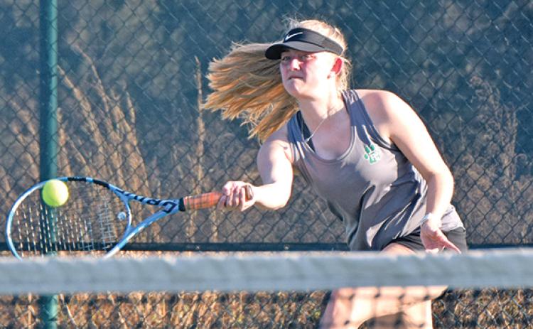 Franklin County singles tennis player Rylee Moore returns a ball during action last week at home against Oconee County.