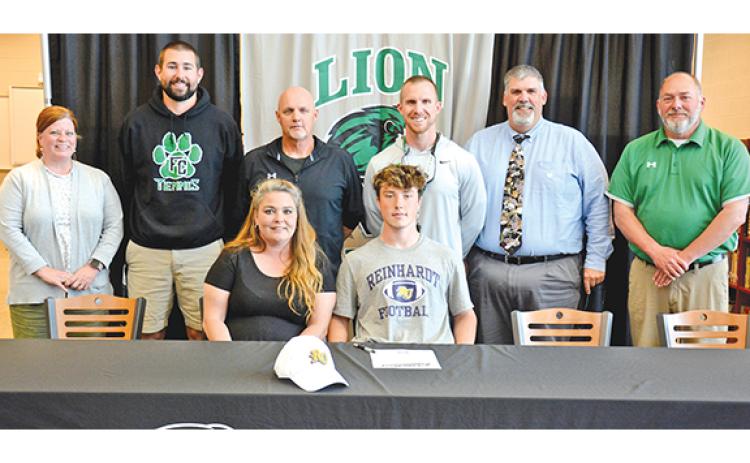 Participating in a signing ceremony for Chris Goode Monday at Franklin County High School were (front) mom Terrie, Chris, (back) FCHS Assistant Principal Natalie Erskine, Coach Bob Brunson, former FCHS Football Coach Paul Sutherland, FCHS Head Coach Parker Martin, Coach David Skelly and Athletic Director Jason Oliver. (Photo by Scoggins)