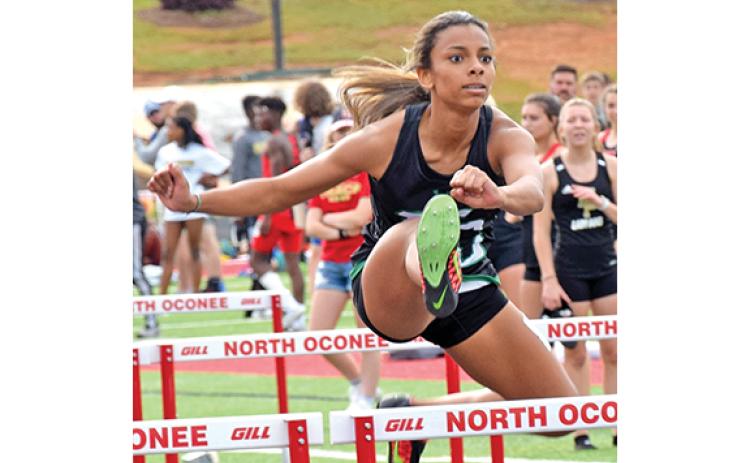Alexus Knox, shown in a photo from a competition last season, broke the school record while winning first place at the prestigious Loch Johnson Invitational Saturday in Athens.