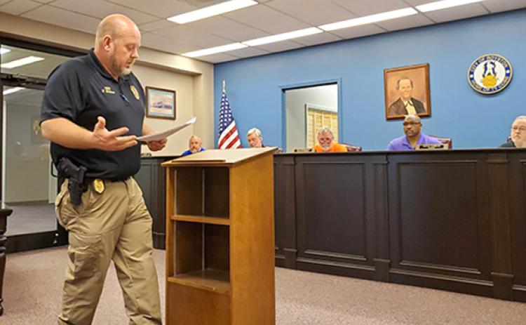 Royston Police Chief Donnie Bolemon explains how two businesses were caught selling alcohol to an underage officer at a called meeting of the Royston City Council Tuesday. After hearing from the businesses and changes they have made to make sure underage sales don’t happen again, the council reinstated the businesses’ alcohol licenses. (Photo by Sinclair)