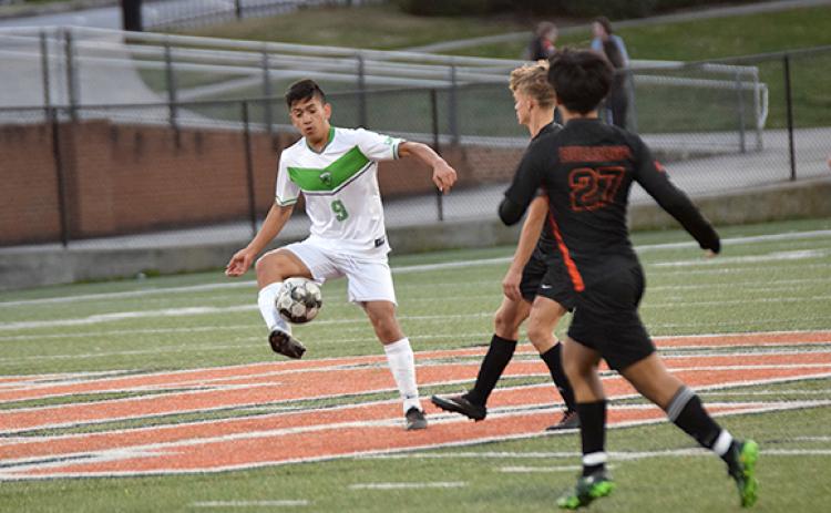Francisco Guadarrama takes the ball down the field. (Photo by Scoggins)