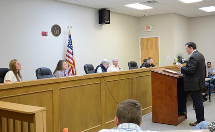 Shane Lanham of Corridor Development lays out plans for a 399-unit townhome development to Planning Commission members (from left) Erika Hewatt, Carolee Coker, Susan Phillips and Bob Ragsdale, along with commission clerk Rocky Farrow. (Photo by Scoggins)