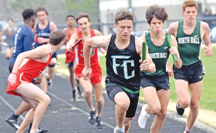 Ben Hardman takes off on his leg of the distance medley  relay Saturday at the 12th annual Eagle Invitational at East Jackson High School in Commerce. Hardman and the Lions finished fourth. (Photo by Scoggins)