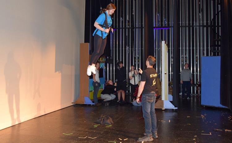 Allie Rich reacts as she pulled into the air for her first flight as Phil Stark from On the Fly coaches her. (Photo by Sinclair)