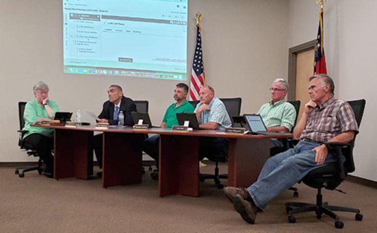 School board members and Superintendent Chris Forrer listen to Jeff Pierce speak during public comment at Tuesday's Franklin County Board of Education meeting. (Photo by Sinclair)