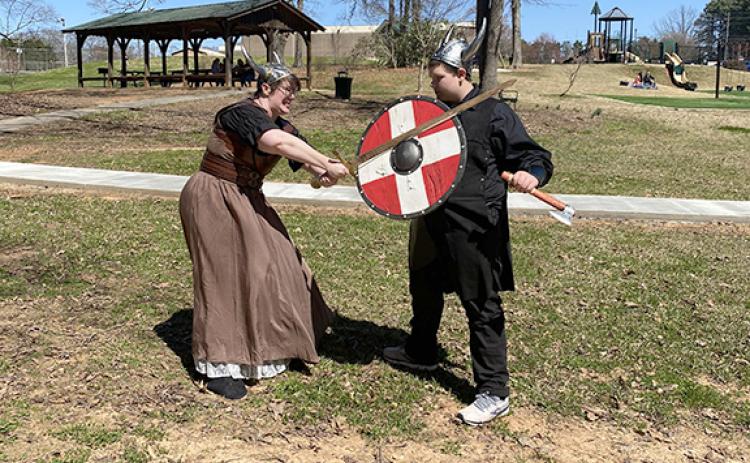 Rebecca Howard and Colton Bradford act out a fight scene in Viking dress. The Vikings will be the theme for the Lavonia Renaissance Festival that will be held Saturday at the Lavonia Memorial Park. (Photo courtesy of Andrea Bradford)