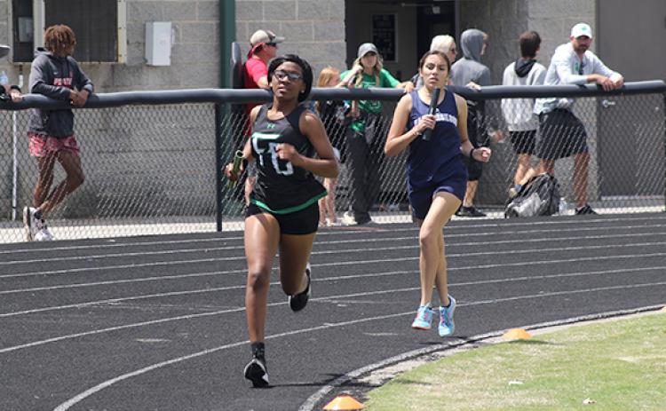 Delayshia Sturghill leads an East Jackson runner in the 4x800 relay at the state sectional meet Saturday in Commerce. (Photo courtesy of Marcus Etienne at The Toccoa Record)