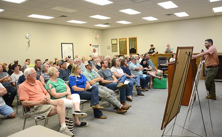 Planning and Zoning Director Scott DeLozier presents information about the UDC to a large crowd at a recent meeting.