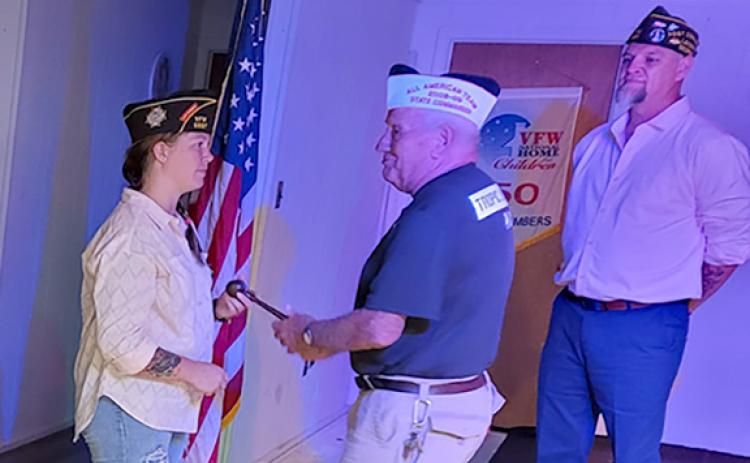 VFW Post 5897 Past Commander Jason Nichols (far right) watches as Commander Gabrielle Beutler is installed Thursday night.