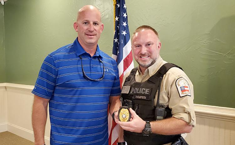 Mayor Lee Moore presents Kevin Thompson with the Franklin Springs Police Chief badge at Thursday’s meeting. (Photo by Sinclair)