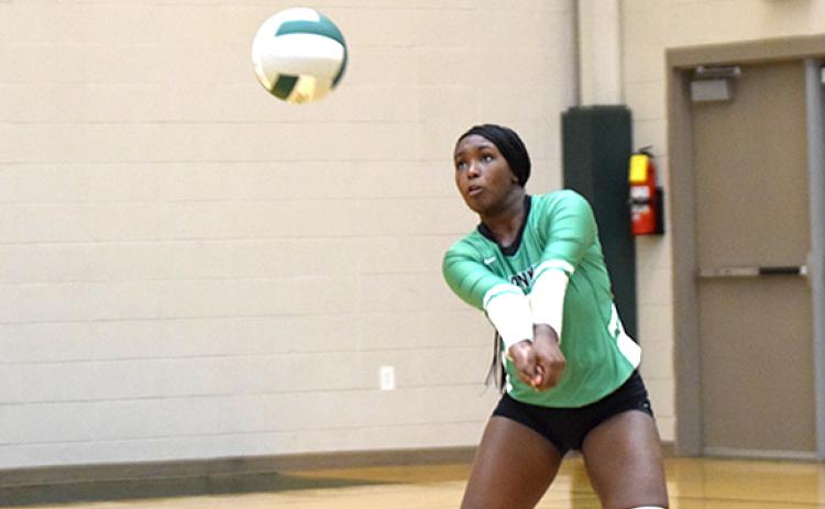 Skye Keller volleys a shot by Commerce Tuesday in Carnesville during the Franklin County Lady Lions’ victory.