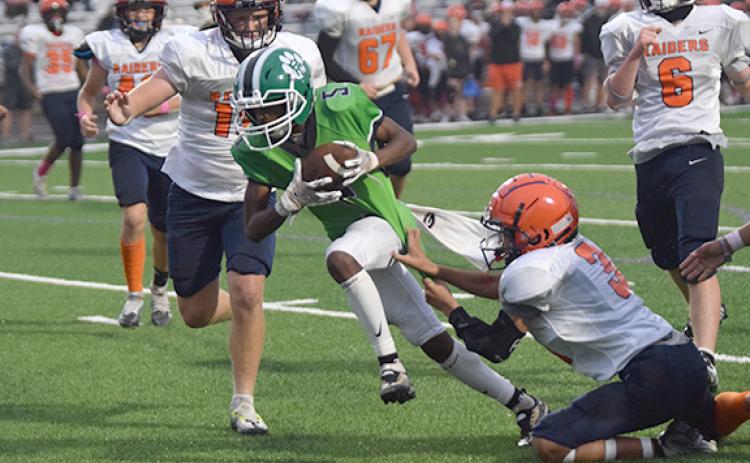 Gavin Wells powers through a would-be tackle on his way to one of his three touchdowns against Habersham County Oct. 12 at Ed Bryant Stadium. (Photo by Scoggins)
