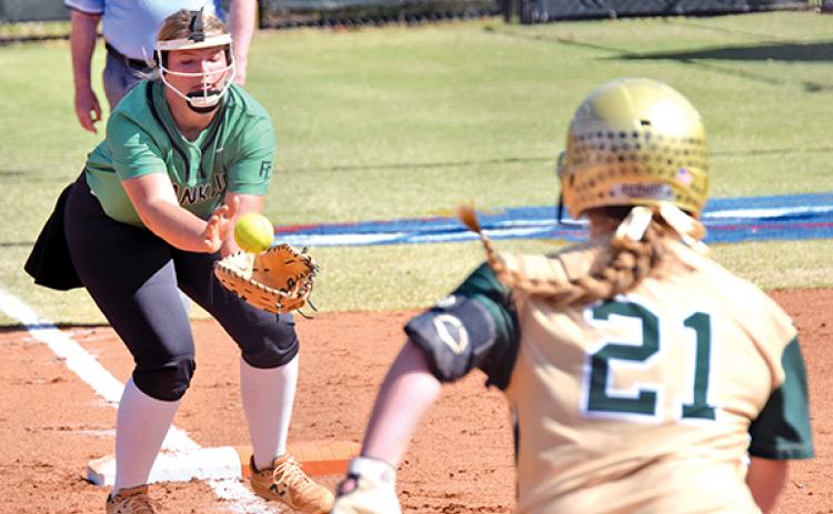 Lady Lion Karson Johnson catches a pop up for an out against Wesleyan in the state super regional last week in Norcross. (Photo by Scoggins)