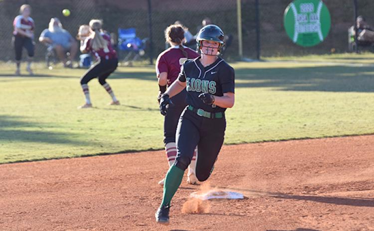 Lady Lion Journey Roberts rounds second on her way to third as Hebron’s outfielders work to get the ball back to the infield. Roberts had two triples, a double and a single in Monday’s victory over Hebron Christian. (Photo by Scoggins)