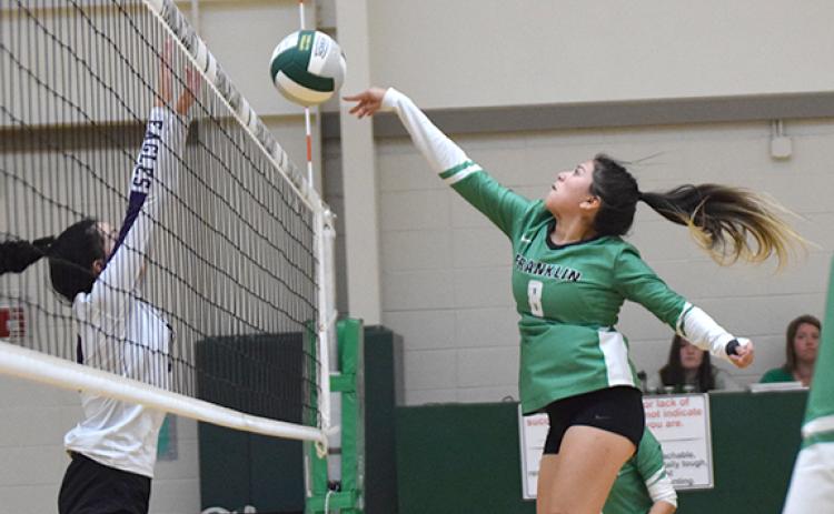 Alejandra Sanchez knocks the ball back over the net in action against Athens Christian Thursday in Carnesville. (Photo by Scoggins)