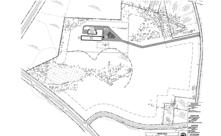 Work on a new SAE barn on High Road has been slowed over whether it will be designated a commercial or agricultural facility.