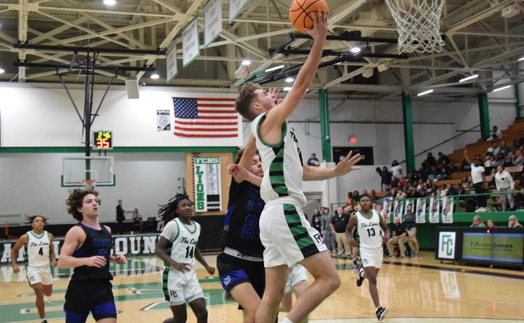 Jachin Frazier lays the ball into the basket Tuesday against Banks County. (Photos by Scoggins)