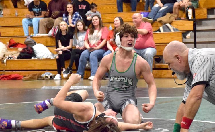 Lion Kenly Eavenson celebrates after pinning his Lakeview-Fort Oglethorpe opponent Saturday in the state sectionals hosted by Franklin County at the Coliseum on Busha Road. (Photo by Scoggins)