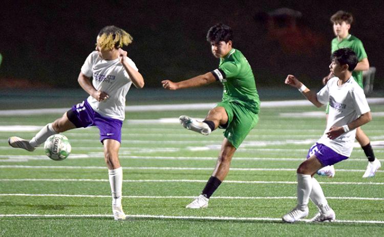 Omar Guadarrama launches a kick that found the net for a goal Tuesday against Monroe Area. (Photos by Scoggins)