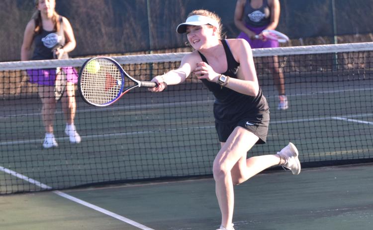 Senior Bonnie Greer Madden reaches for a volley Tuesday in action against Monroe Area in Carnesville. (Photo by Scoggins)