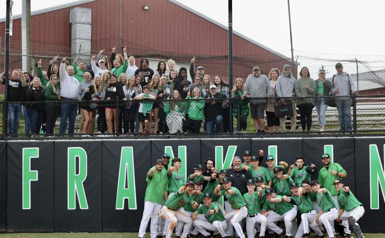 The Franklin County Lions baseball team celebrates with their fans after clinching a first-round state playoff series win Tuesday over Dawson County in the state playoffs. The Lions will be back in action Saturday against Adairsville. (Photo by Rylee Sosebee)