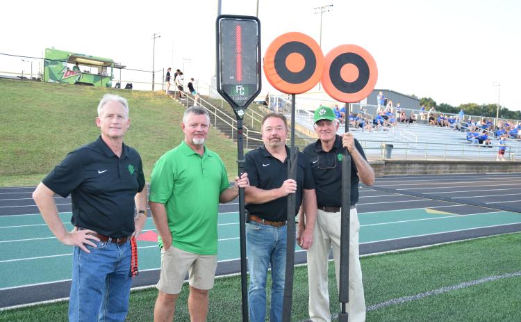 Former football players gathered, spoke to the current team and were recognized as part of the program’s Alumni Night.