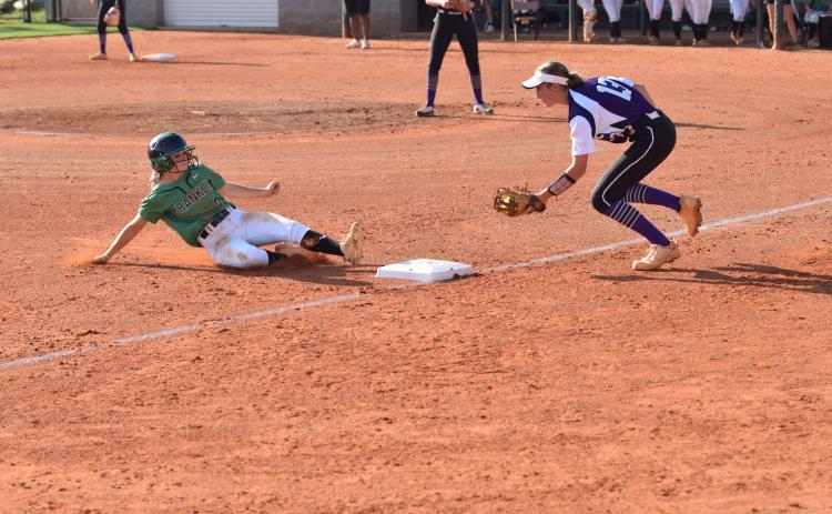 Lady Lion Josie Burton slides safely into third during the Region 8AAA opener against Monroe Area Thursday. (Photos by Scoggins)