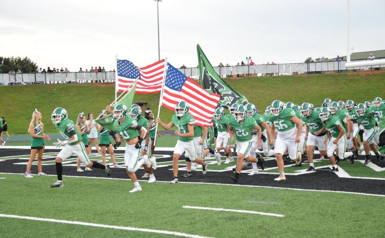To commemorate Heroes Night, during which public servants and military members were recognized, the Franklin County Lions took the field carring American flags Friday at Jeff Davis Field at Ed Bryant Stadium.