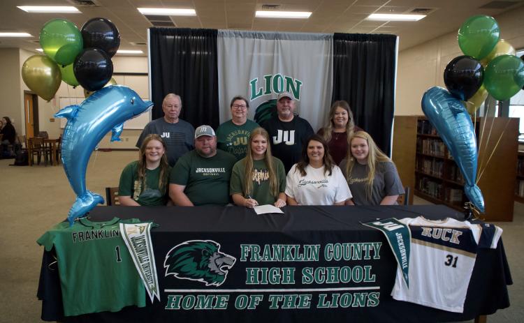 Karson Johnson signed Nov. 8 to play collegiate softball for the Jacksonville University Dolphins.