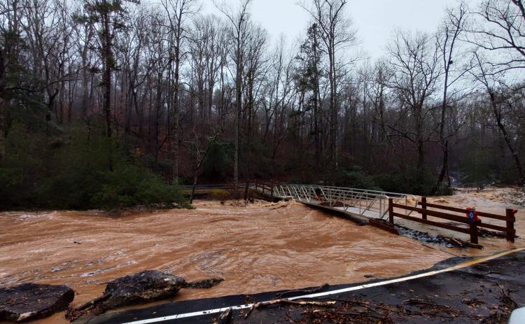 A huge storm system dropped about five inches of rain in about 12 hours on Franklin County Tuesday, swelling creeks and rivers out of their banks, flooding driveways and, along with gusty winds, felling trees.