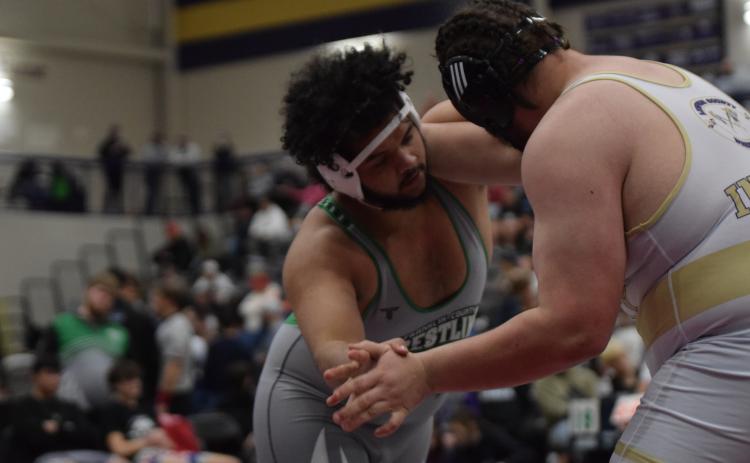 Lion Jacob Baker takes on a Lumpkin County wrestler in the state duals semifinals Saturday in Dahlonega.