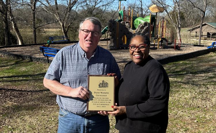 Now former Mayor Harris Little presents Patsy Watkins with a plaque to commemorate her eight years of service on the Carnesville City Council.