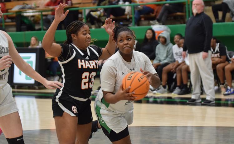 Emiyah Strange drives past a Hart defeander and looks for a shot in the Lady Lion’s final home game of the regular season Friday. (Photos by Scoggins)