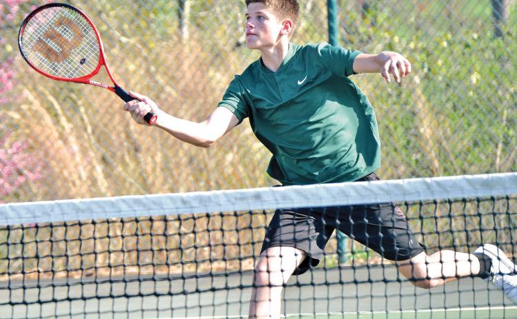 Martin Lunsford (above) returns a ball in tennis action earlier this season.