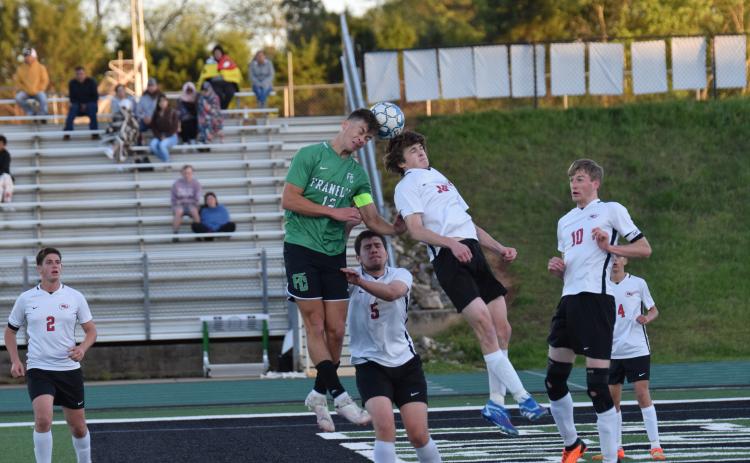 Lion Max Bridges goes up for a header during action Friday at Jeff Davis Field at Ed Bryant Stadium in a win over Stephens County to clinch a state playoff spot. (Photo by Scoggins)