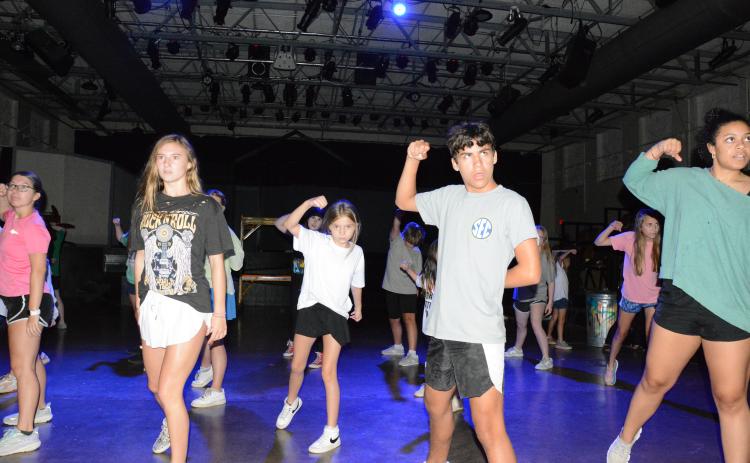 Brock Fowler (right) and Bristol Patterson (left) rehearse a dance routine for the Youth Summer Theater’s upcoming production of “The Descendants – The Musical.” The annual summer camp for young people, sponsored by Franklin Community Players, will perform the Disney musical Friday, Saturday and Sunday at the Lavonia Cultural Center. (Photo by Eavenson)