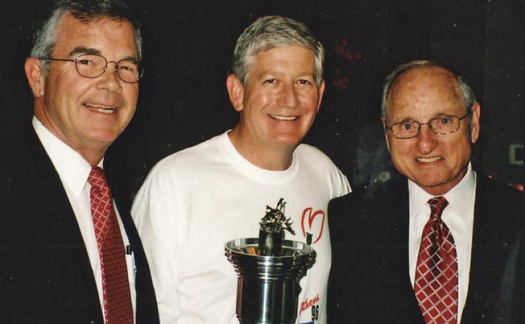As chairman of Athens 96, top left, I worked with 28 volunteers to coordinate the community’s involvement in the Games. Top right, my leg of the torch run was in Stephens County. To celebrate the 10th anniversary of the 1996 Olympics, the Athens torch run was re-enacted. Above, I’m with Billy Payne, left, and former UGA football coach and athletic director Vince Dooley at the anniversary celebration.