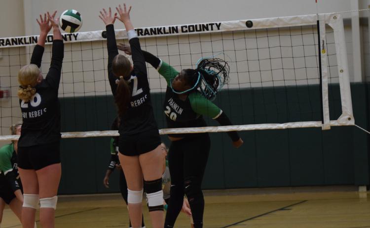 Senior TaKiyah Merriett spikes a ball against Fannin County in the Lady Lions’ season opener Friday at Rocky Ford Park. (Photos by Scoggins)
