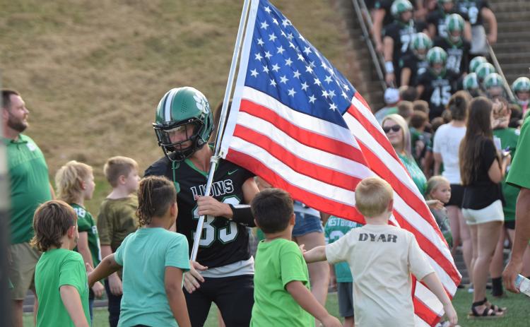 The Franklin County Lions opened the 2024 football season Friday with a close 27-21 loss to Chestatee at Jeff Davis Field at Ed Bryant Stadium. The game began with the recognition of football players and cheerleaders from the Franklin County Recreation Department, who lined up to welcome Keyes Harbin (No. 33) and his Lion teammates.