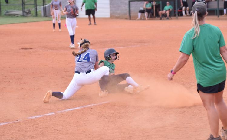 Macy Moore slides safely into third base Monday in a win over Elbert in Carnesville. (Photo by Scoggins)