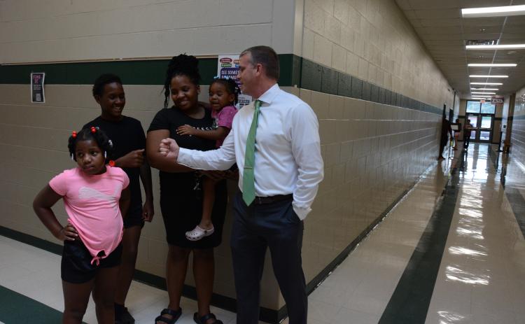 New Franklin County Middle School principal, Dr. David Cawthon, assists a family during the school’s open house on Tuesday. They are (from left) Paris Woulard, Xavier Ellis, Shamira Ellis and Zariah Woulard. (Photos by Eavenson)