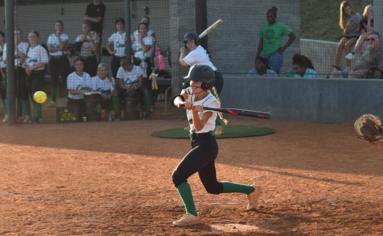 Josie Burton (above) prepares to swing in a Region 8AA victory over East Jackson Tuesday in Carnesville.