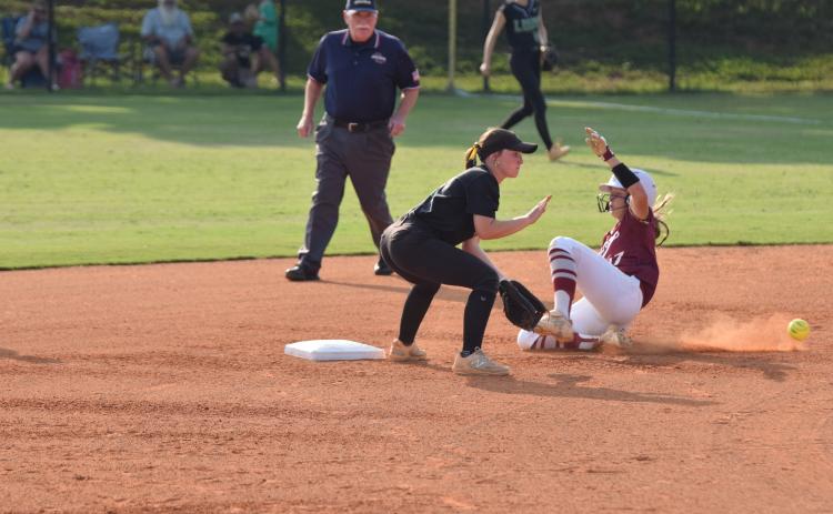 Lady Lion shortstop Hayden McGee takes a throw to second as a Hebron Christian runner steals second during Tuesday’s Region 8AA contest in Carnesville. (Photo by Scoggins)