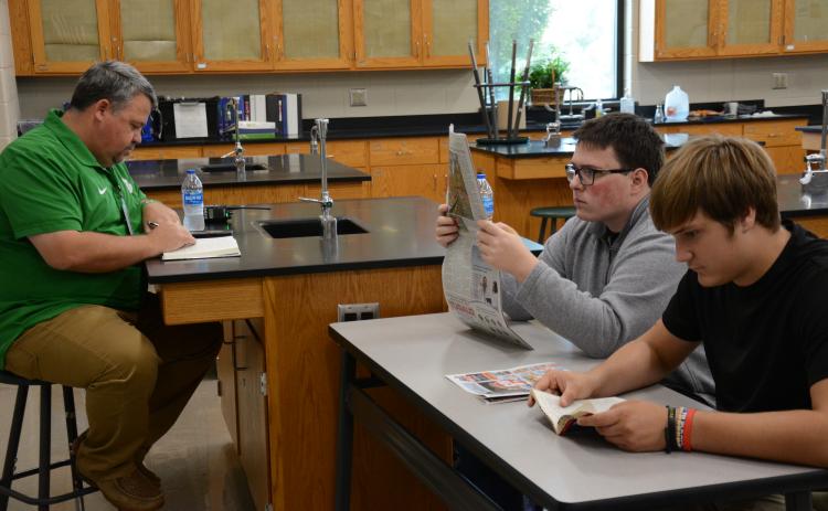 Franklin County High School Principal Matt Stowers (left) joins students in reading for 20 minutes a day, four days a week at FCHS. (Photo by Eavenson)
