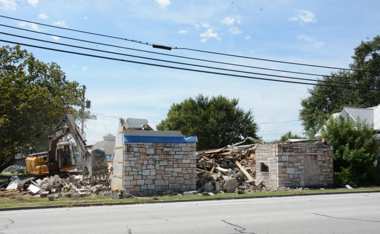 LAVONIA – A contractor for the City of Lavonia demolished the city-owned Ford Theatre building on Vickery Street Tuesday. Most recently, the old rock building had housed Lavonia Masonic Lodge No. 241. Mayor Courtney Umbehant said that plans are under way to expand the Downtown Weldon Park where the gazebo is located. (Photo by Eavenson)