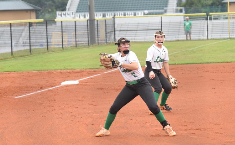 Pitcher McCall Davis prepares to make a throw to first in a game earlier this season. Davis struck out 11 Tuesday in a 6-1 win over Hebron Christian in Dacula.